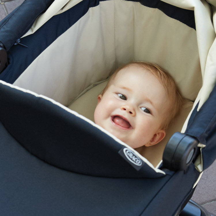 Little baby in Graco® Evo® luxury carrycot
