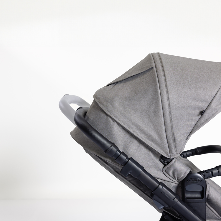 Profile view of the telescopic handle on the Near2Me DLX pushchair.
