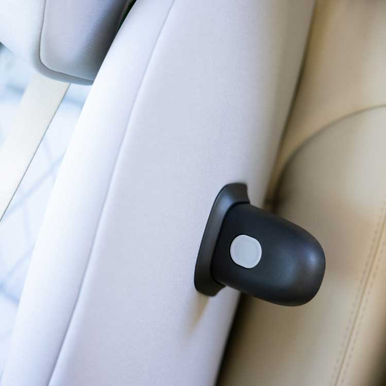 Close up of interchangeable TrueShield side impact protection pod installed in the Graco SlimFit R129 2-in-1 convertible car seat. 
