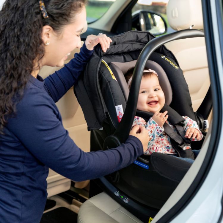Baby buckled in Graco SnugEssentials i-Size car seat