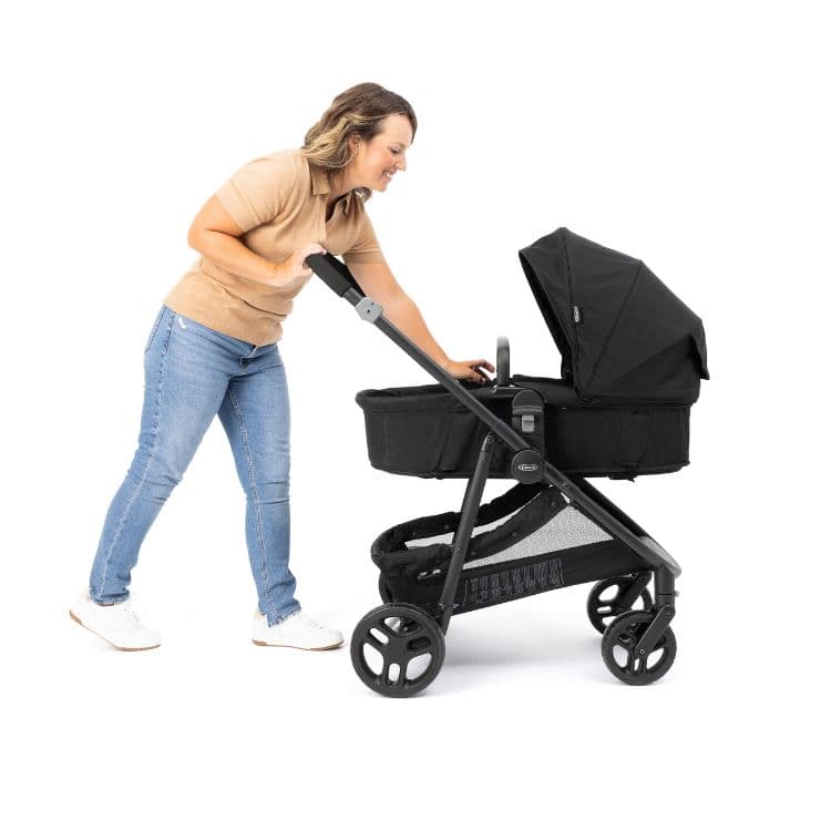 Mum interacting with baby in Graco Transform in pramette mode