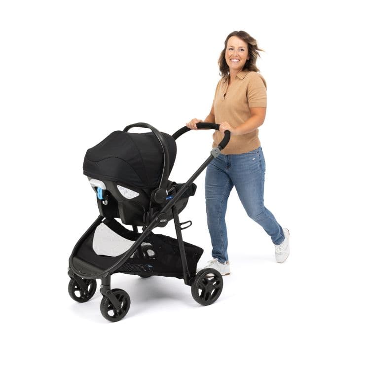 Mum pushing Graco Transform pushchair with infant car seat attached