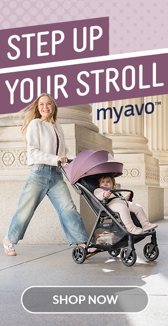 Mum smiling and pushing Graco Myavo with toddler buckled in.